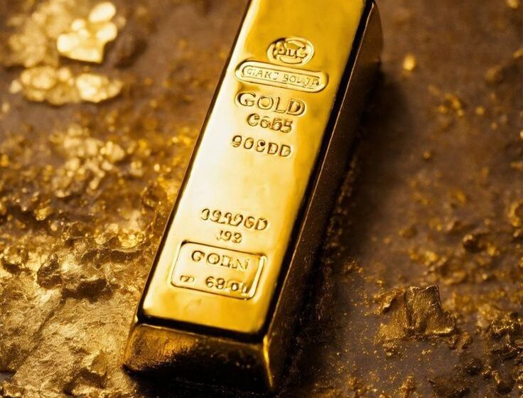  Ouro recua com valorização do dólar e cautela antes de decisões sobre a Fed